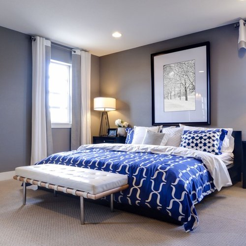 Bedroom with blue bed colour